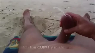 Curved cock wank and cum at unclad beach