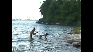 Hot naked bathers banging on the shore of the lake