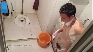 Adult Chinese man attracting a shower
